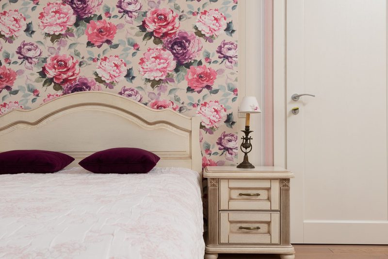 Traditional bedroom with a rose-patterned floral wallpaper